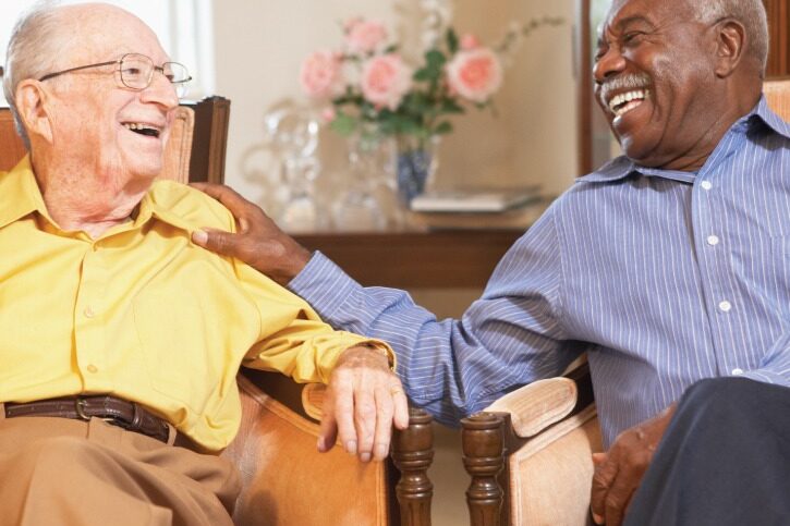 Senior men chatting in the common area