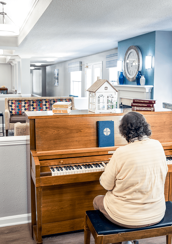 Newark senior playing the piano