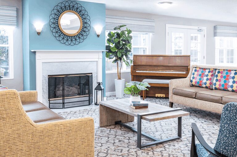 Common gathering area near the fireplace with a piano.
