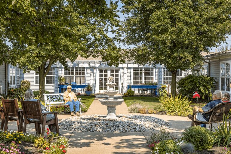 Seniors sitting in a courtyard